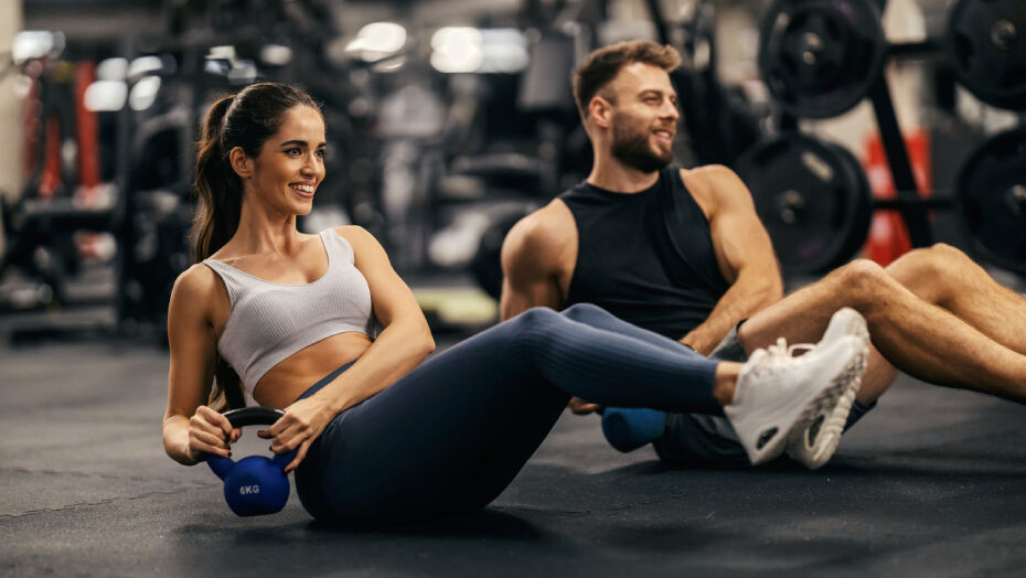 Man and woman working out in a gym