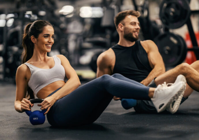 Man and woman working out in a gym