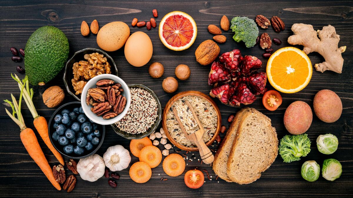 Array of high fiber foods set up on wooden background