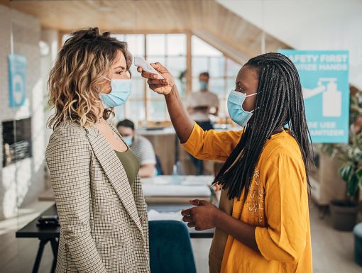 Woman getting temperature checked