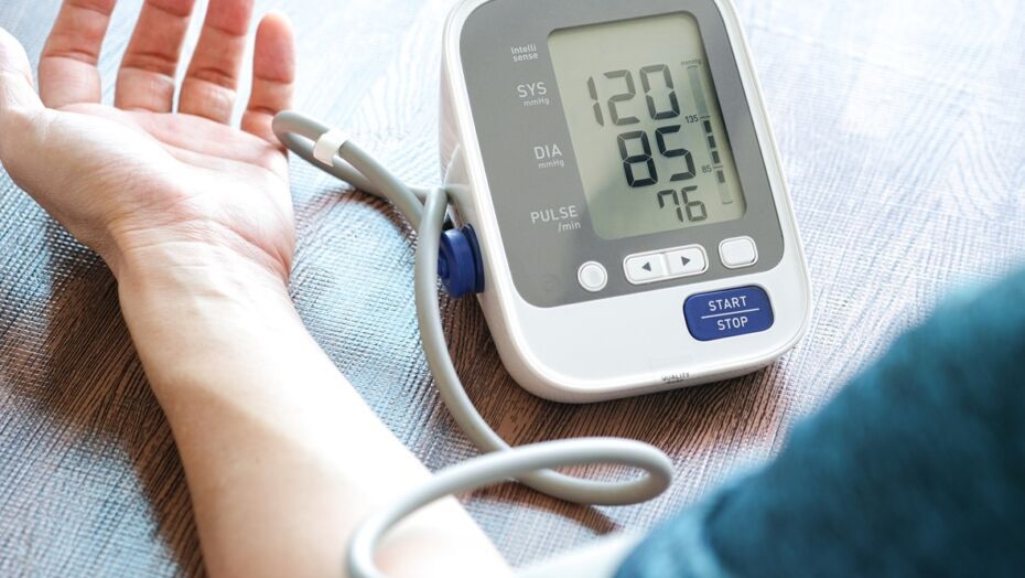 Man check blood pressure monitor and heart rate monitor with digital pressure gauge