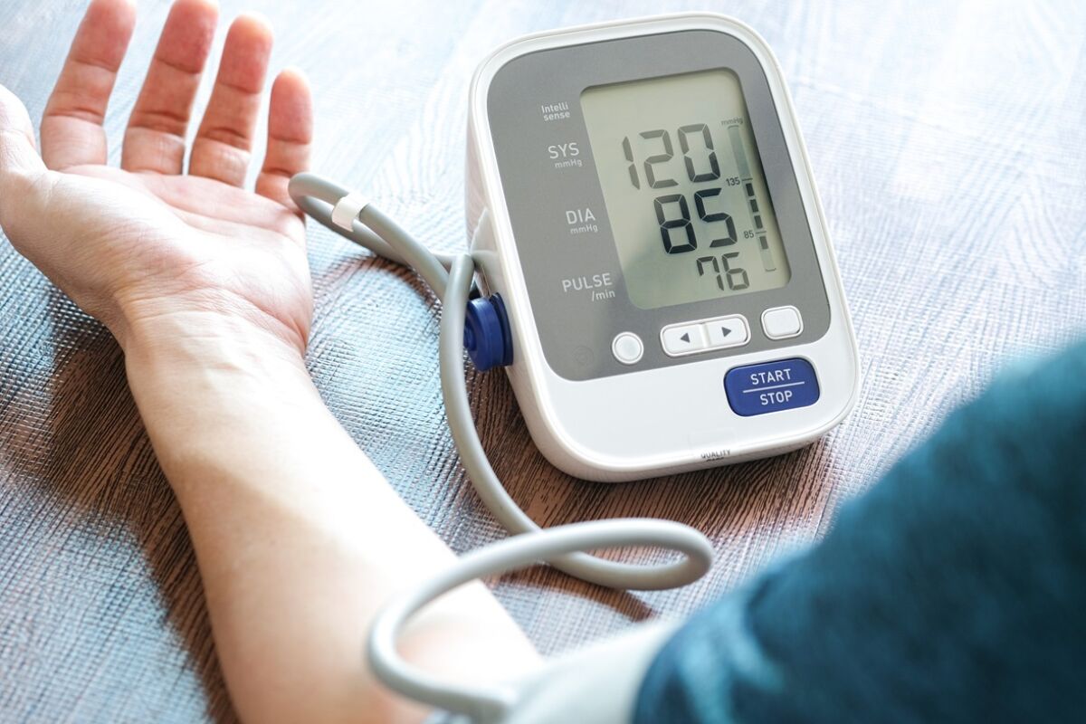 Man check blood pressure monitor and heart rate monitor with digital pressure gauge