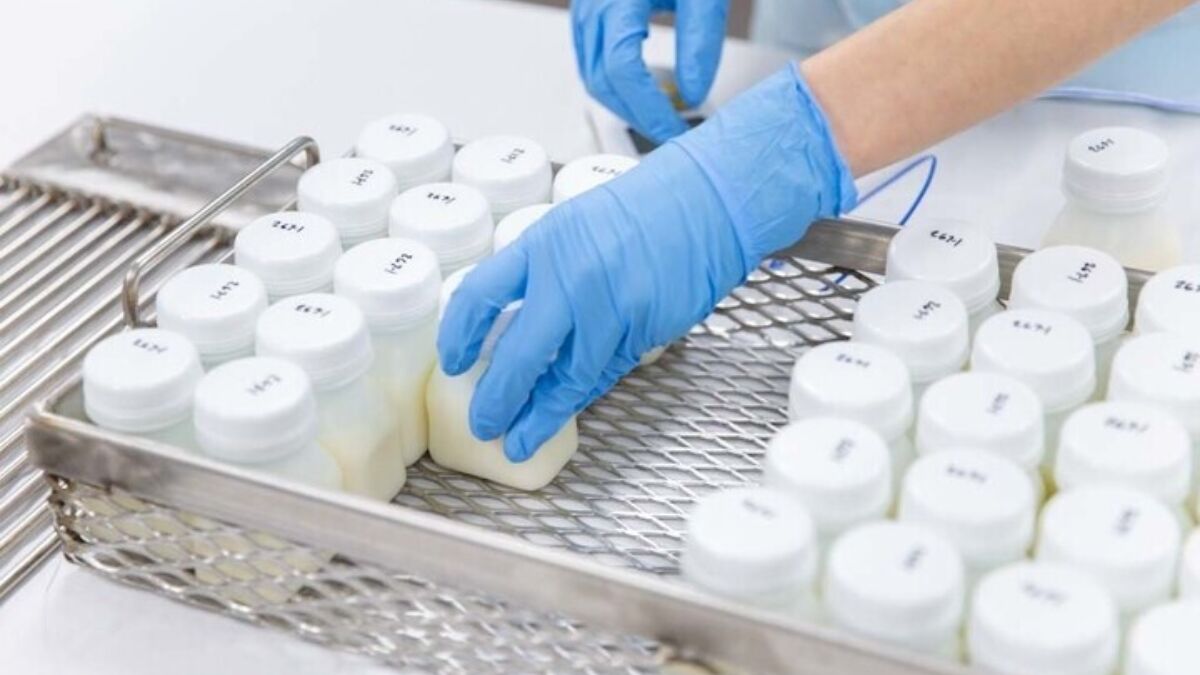 Small bottles of breastmilk being stored in freezer