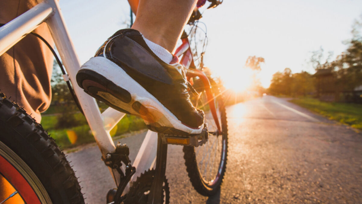 image of feet on bike pedals while riding outdoors