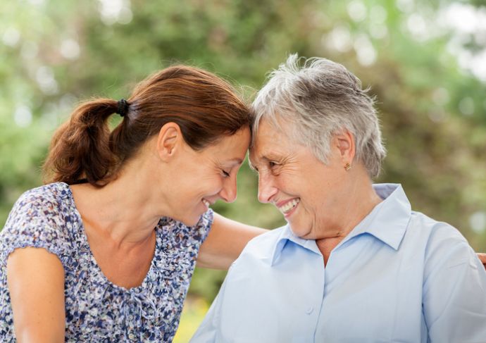Younger woman with her mom who has Alzheimer's disease