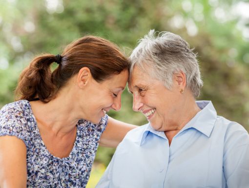 Younger woman with her mom who has Alzheimer's disease
