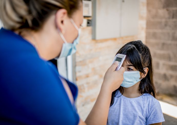 School nurse checking temp