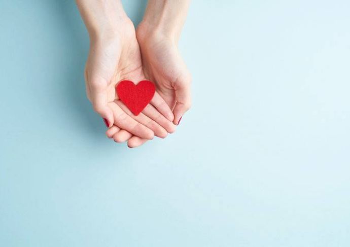 Hands holding a heart