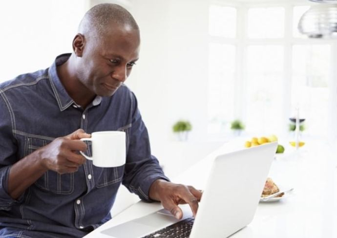 man researching on laptop