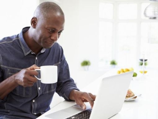 man researching on laptop