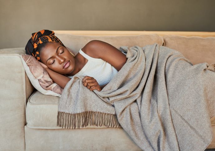 Woman sleeping on a couch