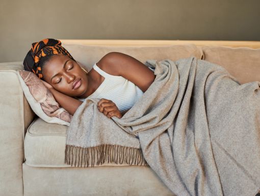 Woman sleeping on a couch
