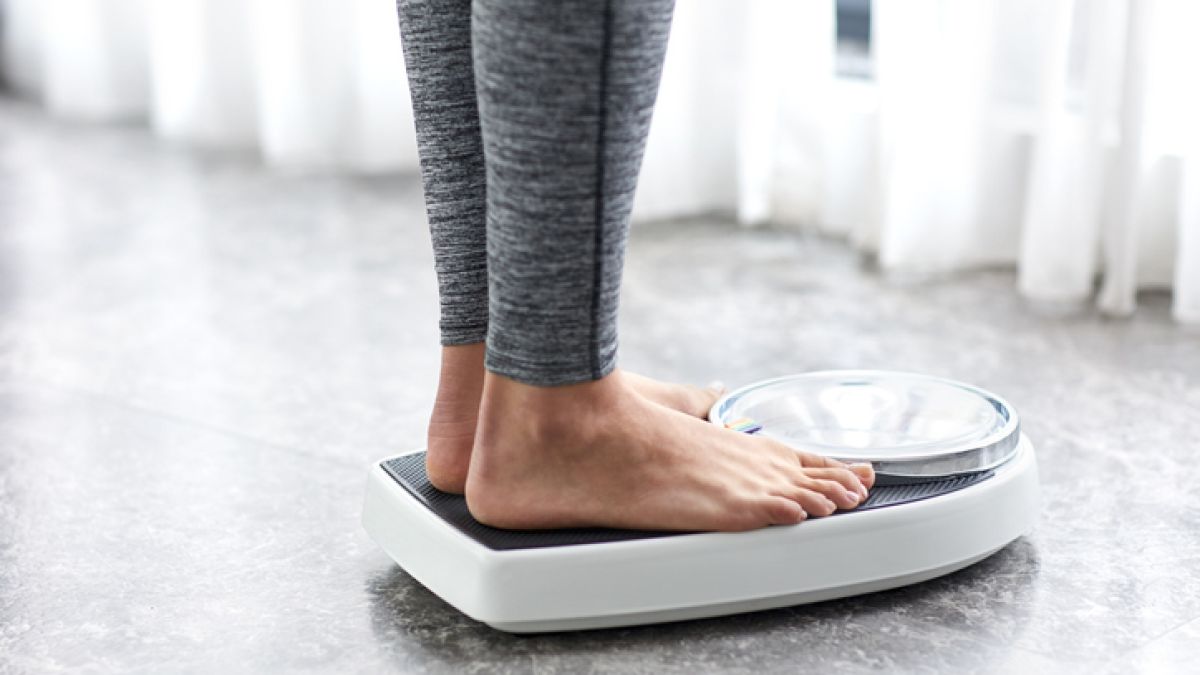 Person stepping on a scale