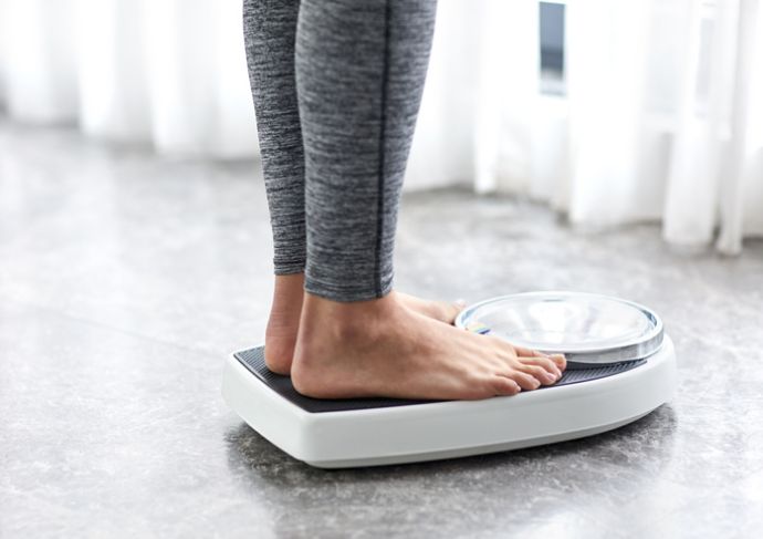Person stepping on a scale