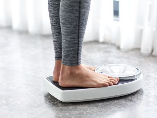 Person stepping on a scale