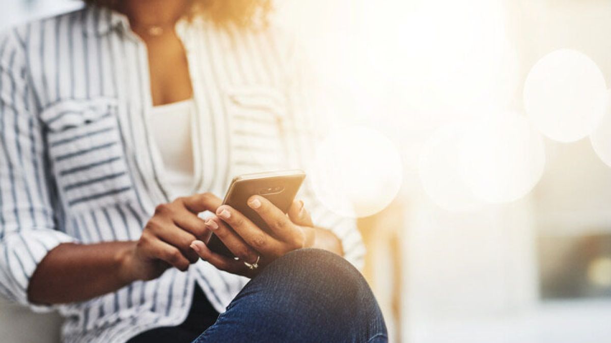 Young woman using phone