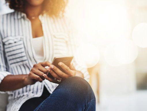 Young woman using phone