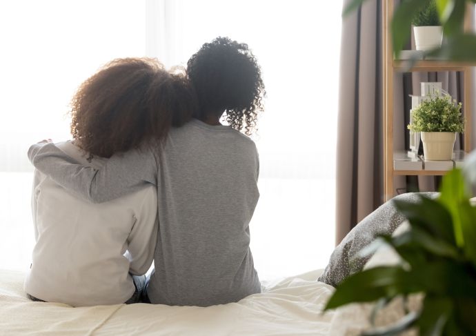 Mom hugging daughter