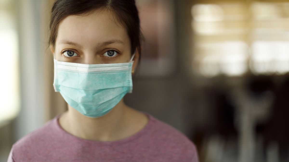 Teenage girl with mask