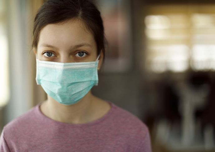 Teenage girl with mask