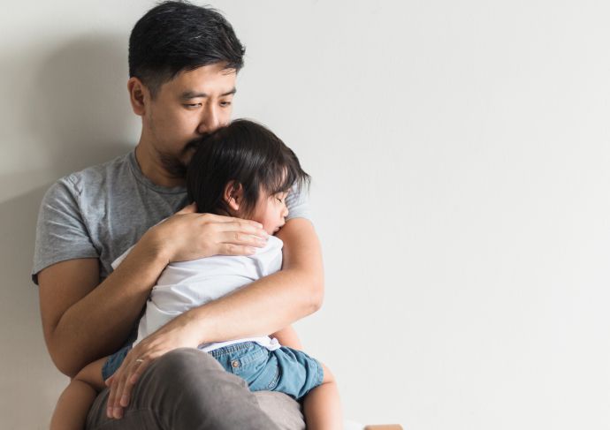 Father comforts son