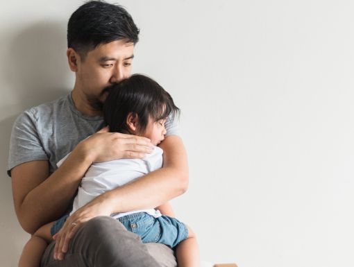 Father comforts son