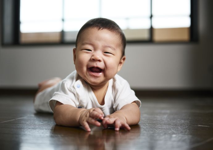 Smiling baby on floor