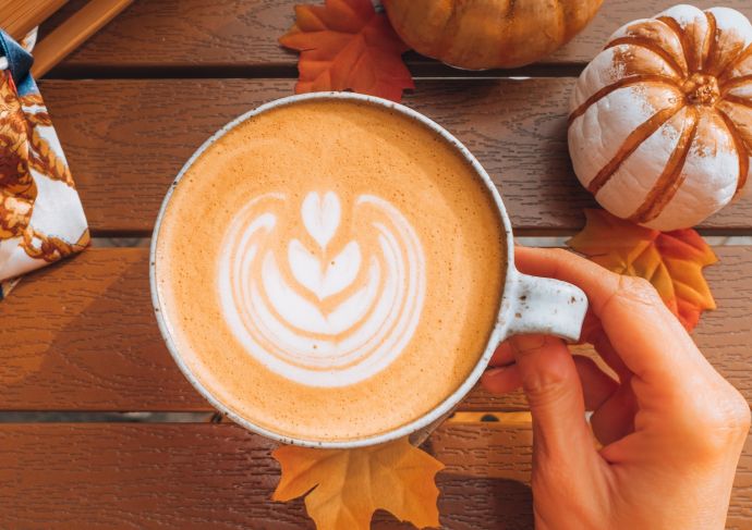 cup of pumpkin spice latte with cute design