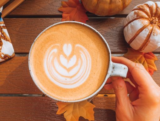 cup of pumpkin spice latte with cute design