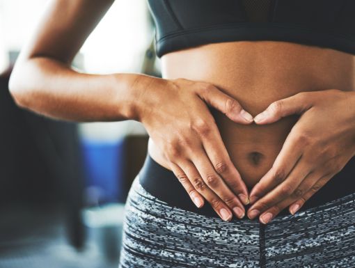 woman holding her stomach