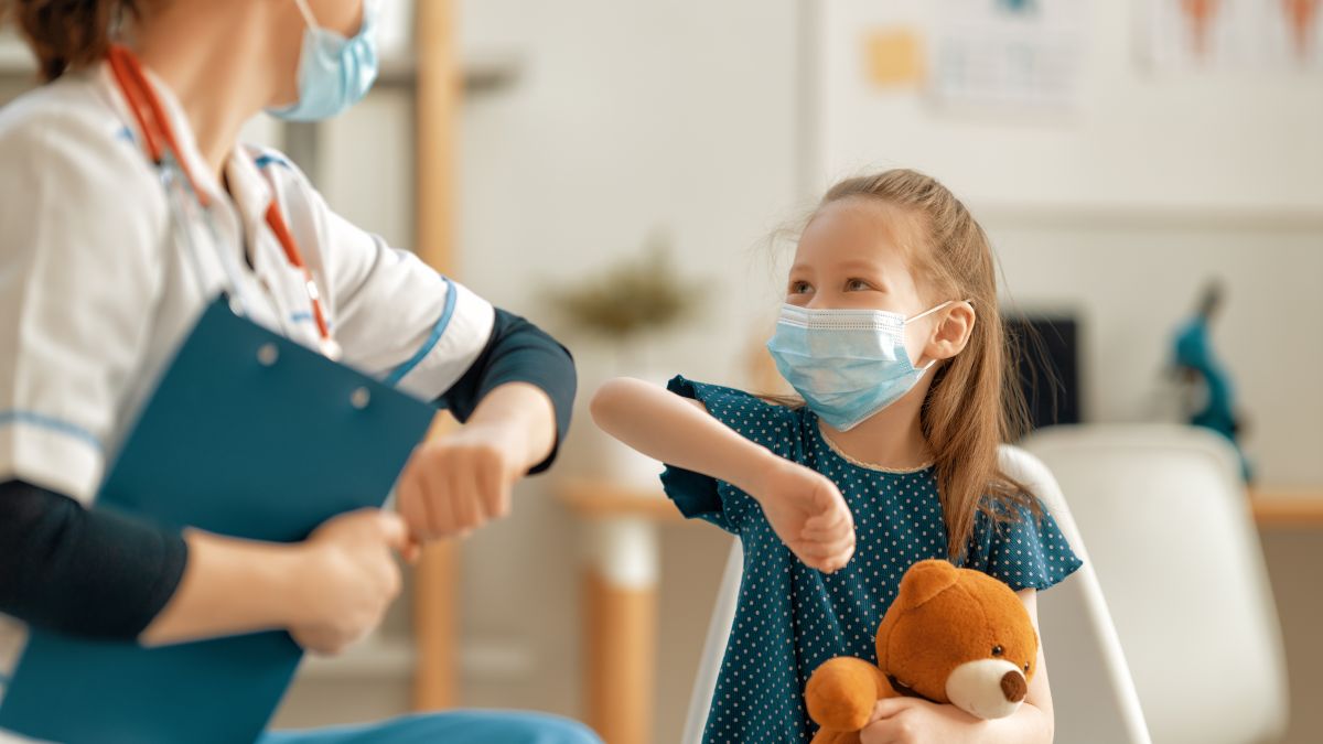 Kid and physician in masks