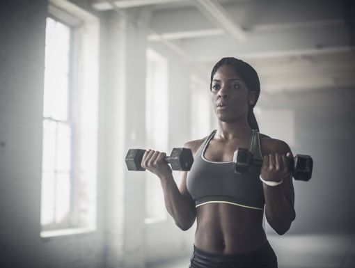 Woman using dumbbells