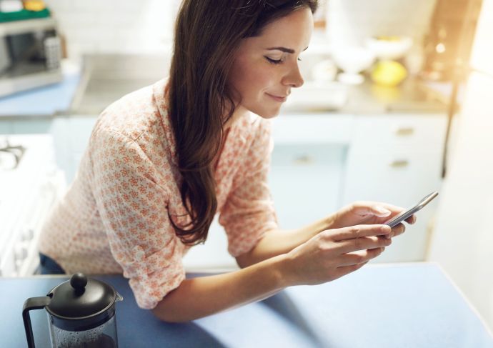 Young woman using phone