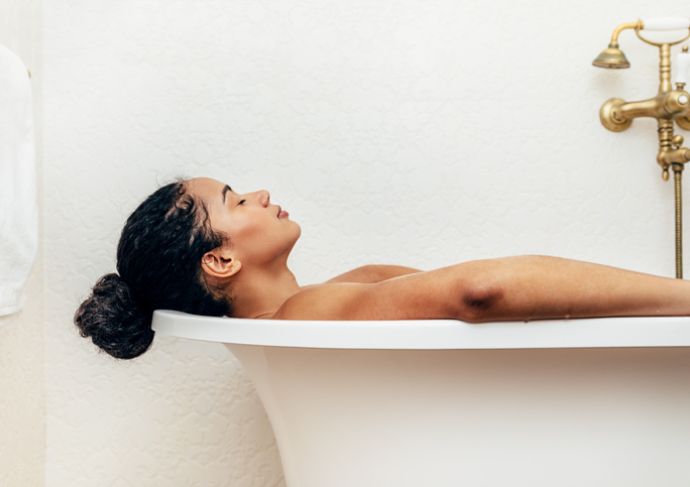 Woman sitting in the bath