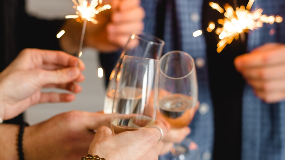 People clinking glasses with mocktails at New Year's