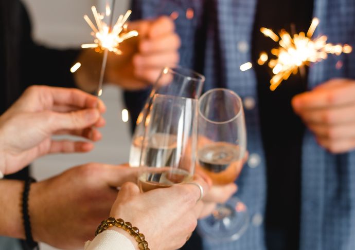 People clinking glasses with mocktails at New Year's