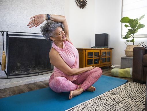 Older woman exercising at home