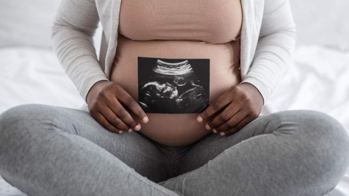 Woman holding ultrasound
