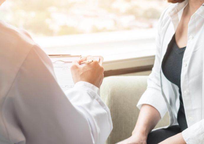 Doctor talking with female patient 5