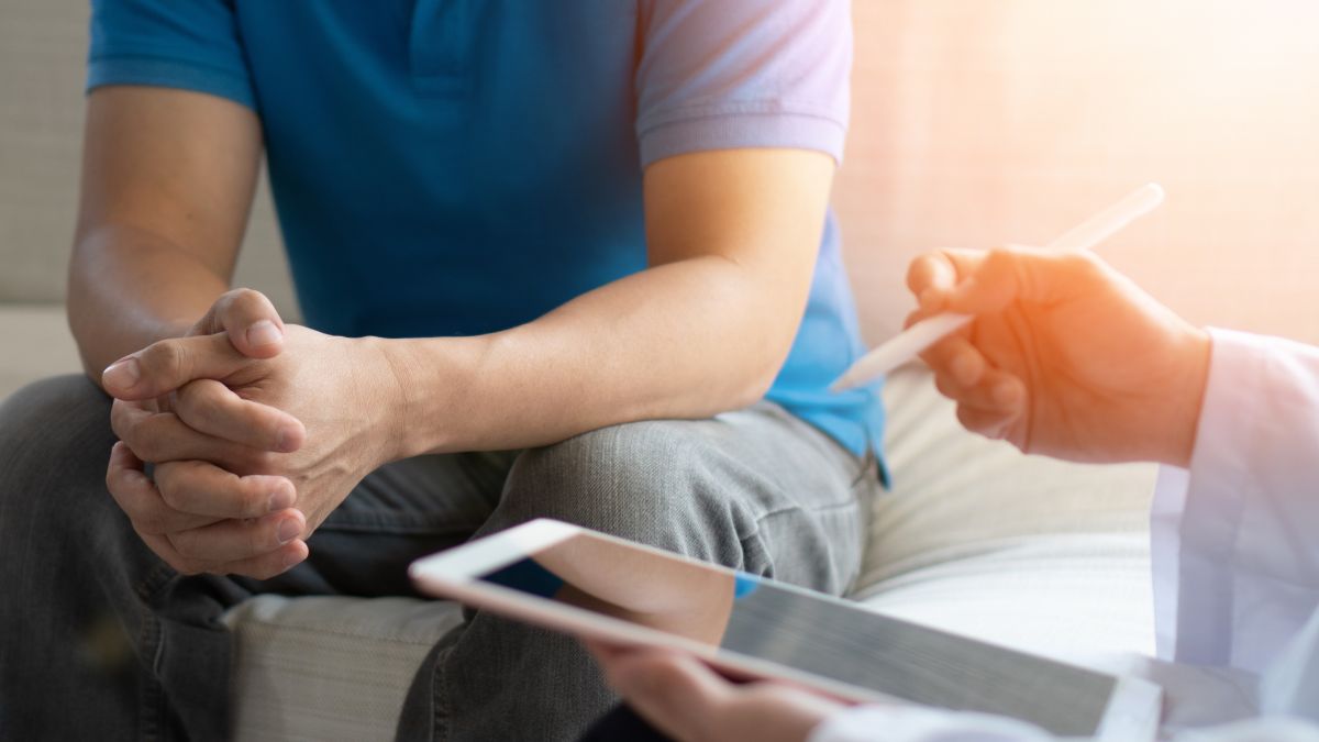 Man speaking to doctor