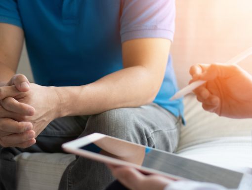 Man speaking to doctor