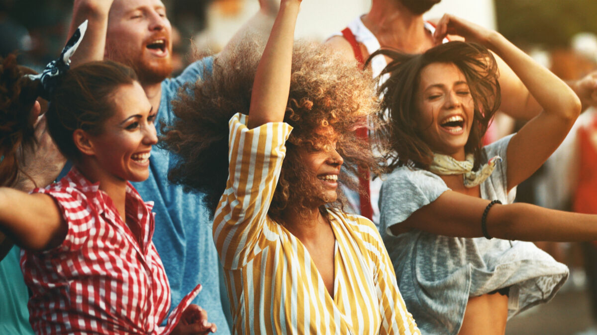 Friends dancing during festival
