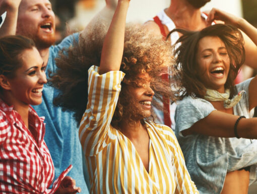 Friends dancing during festival