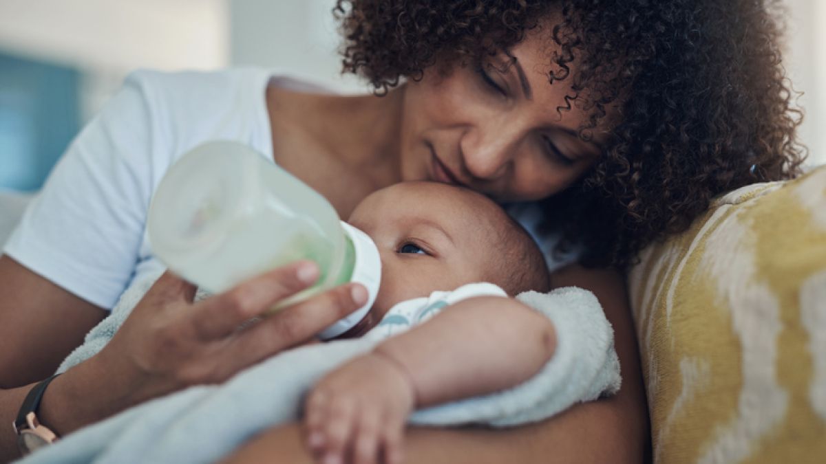 Mother feeding baby with a bottle
