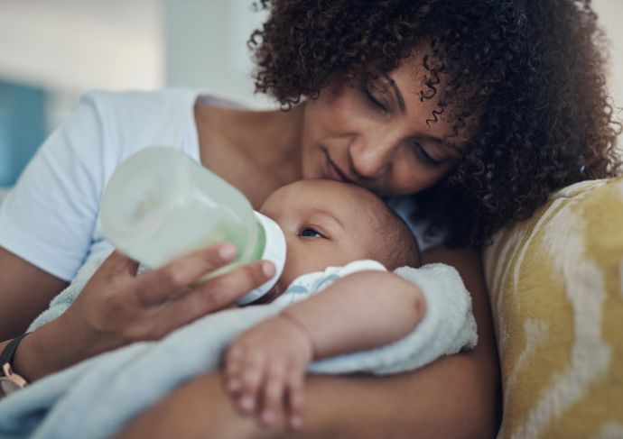 Mother feeding baby with a bottle