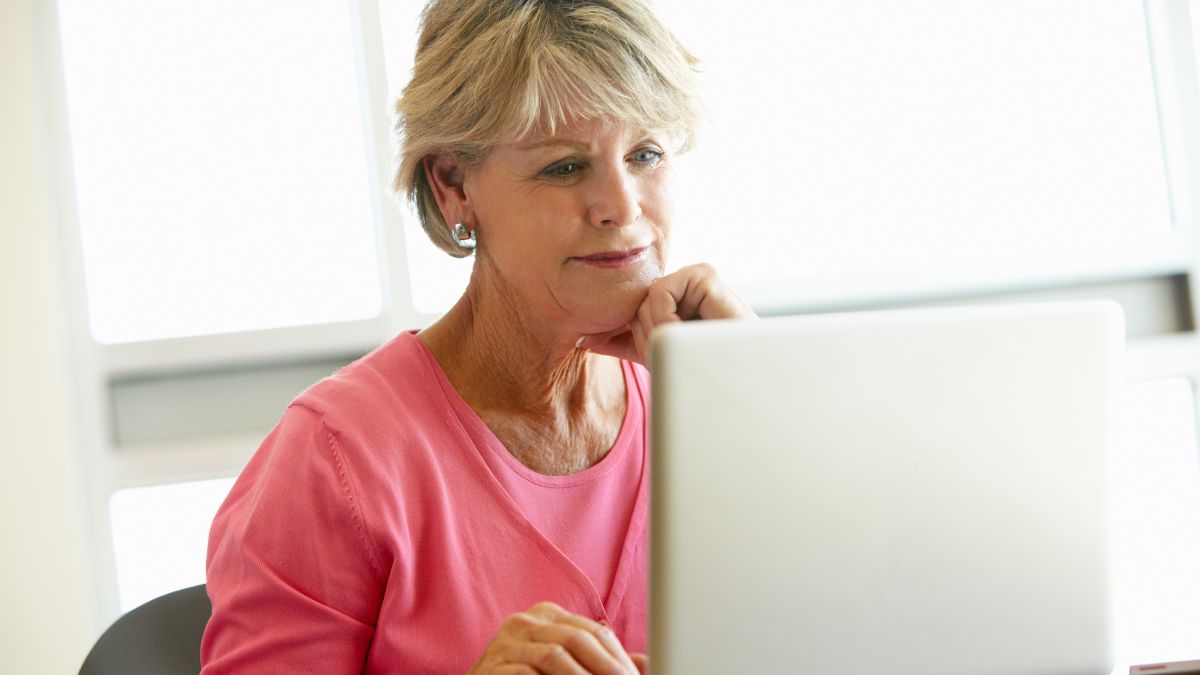 Aphasia older woman reading computer