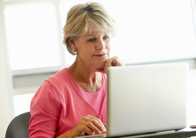 Aphasia older woman reading computer