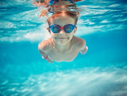 Child Swimming in Water