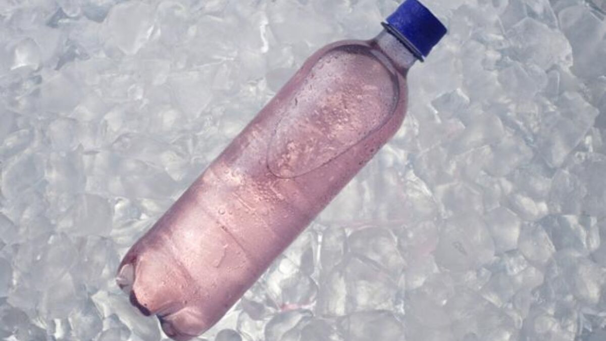 Purple electrolyte drink in a plastic bottle