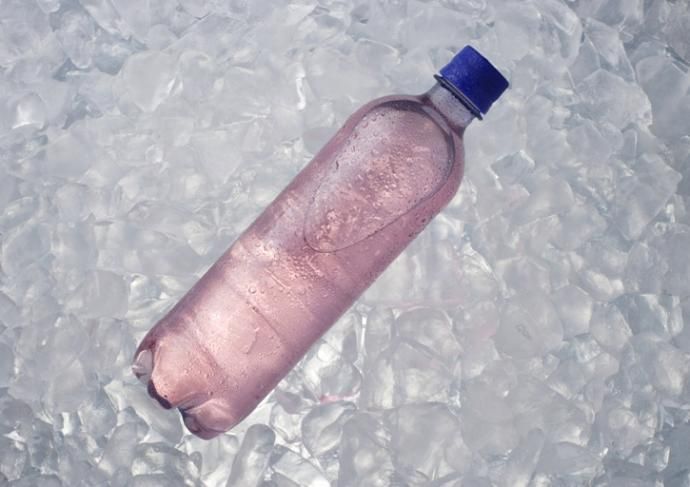 Purple electrolyte drink in a plastic bottle